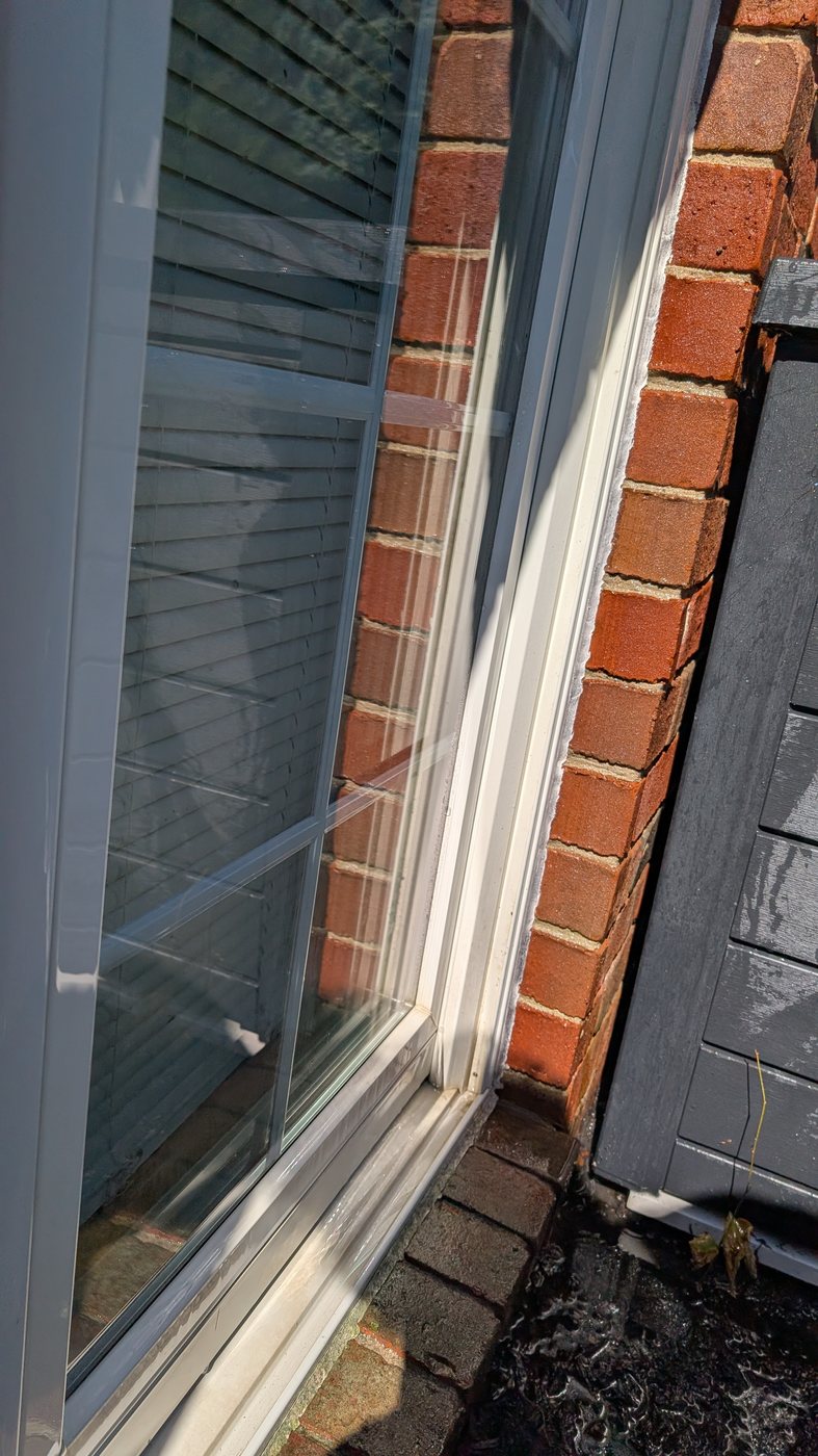 Clean window after professional cleaning by Ethan's Window Cleaning near Howell, MI