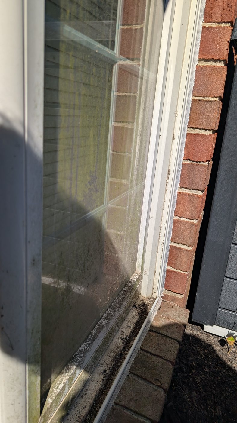 Dirty, grime-covered window before professional cleaning
