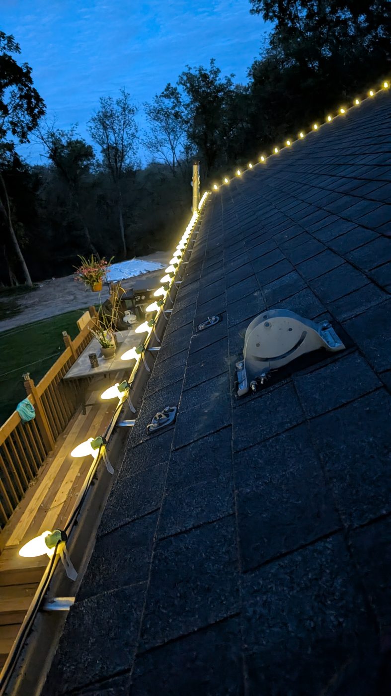 Close-up of professional Christmas light clips and bulbs installed near Howell, MI